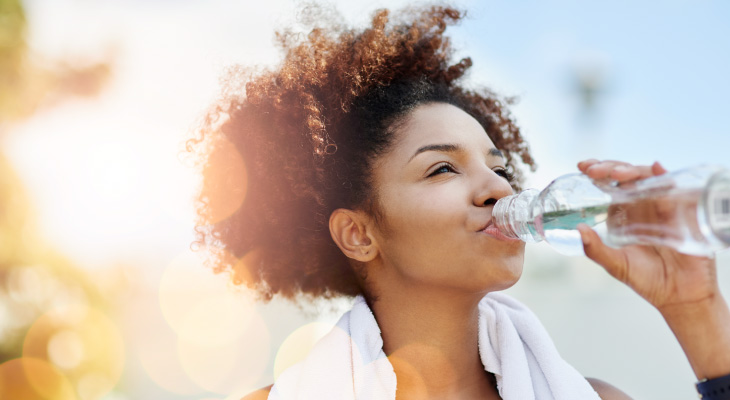 african american woman drinking water