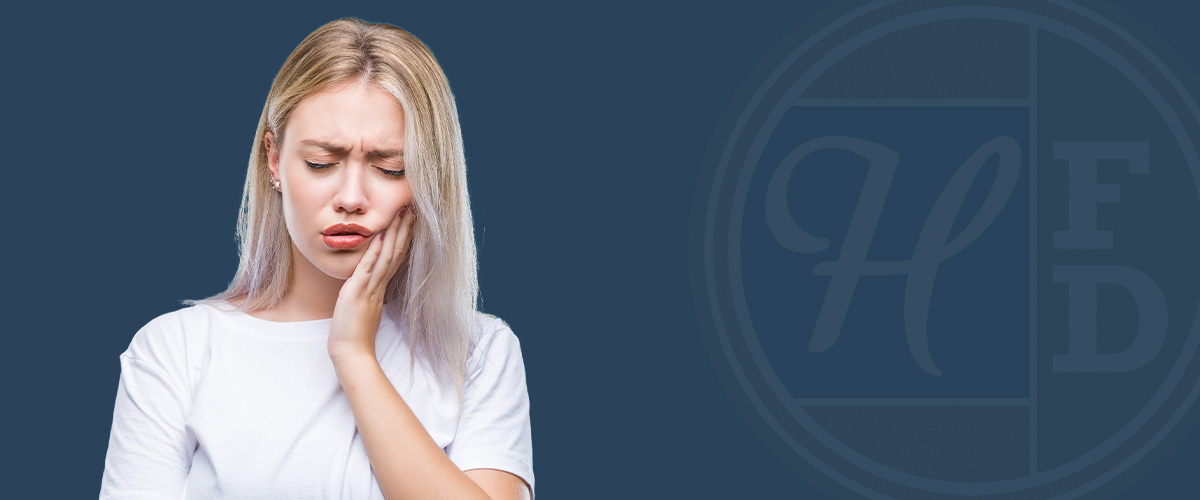 woman with root canal jaw pain