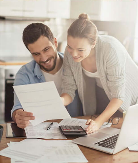 man and woman looking at paperwork