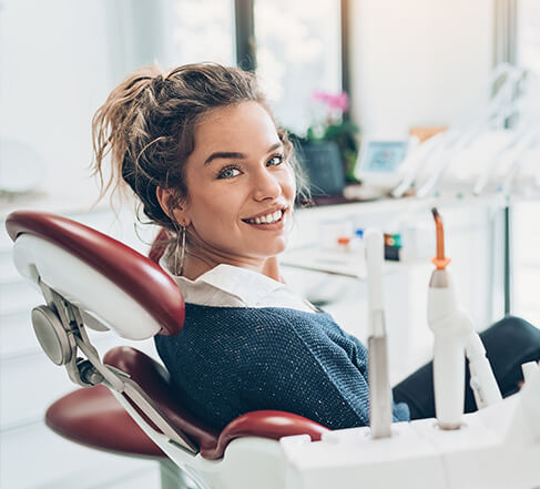 happy woman smiling in dentist chair